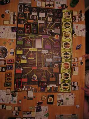 Overhead view of an Arkham Horror game in progress